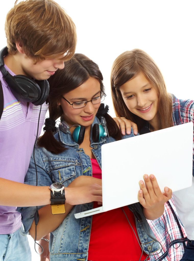 Three teenagers studying with laptop